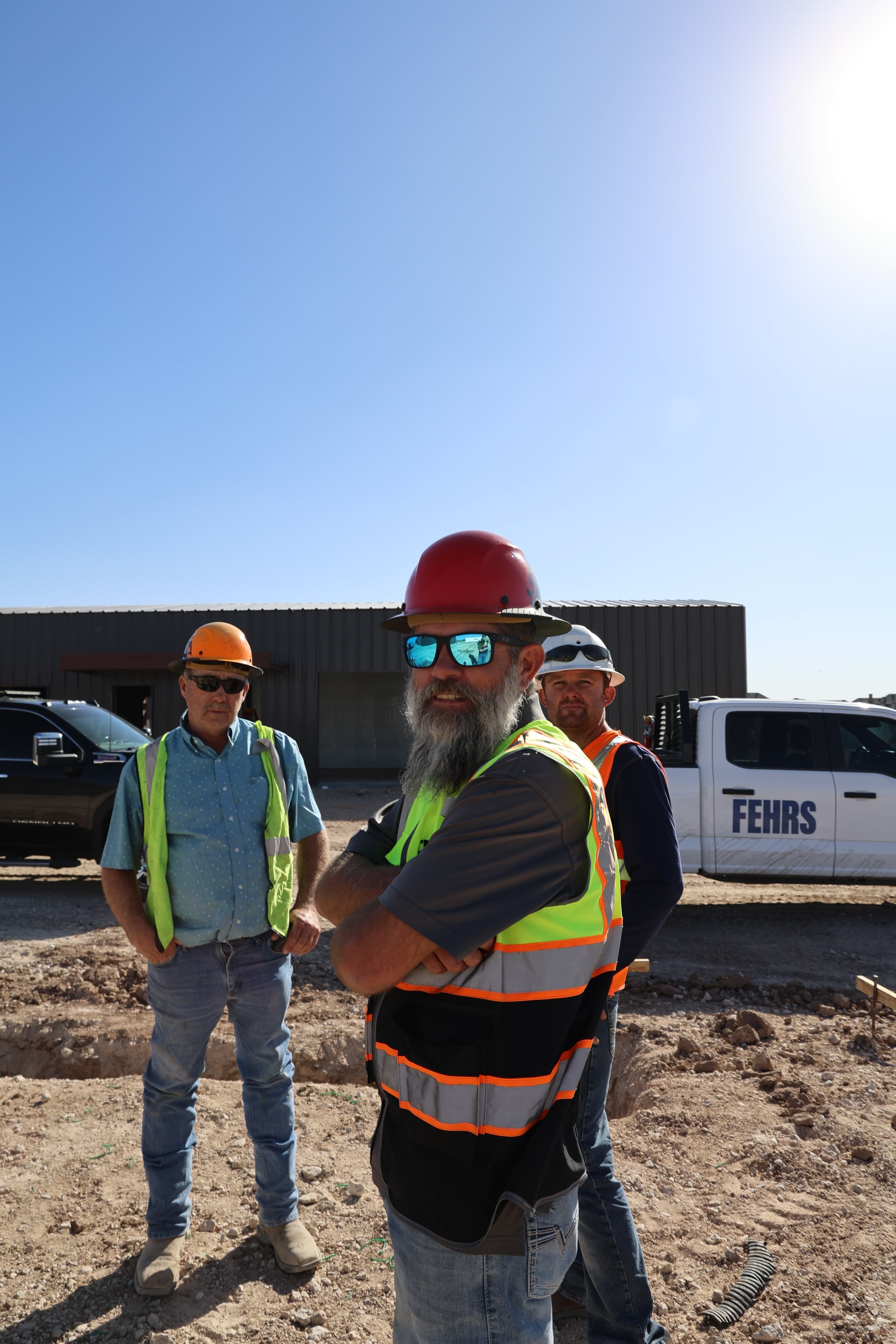 Precision Screeding crew on an active job site